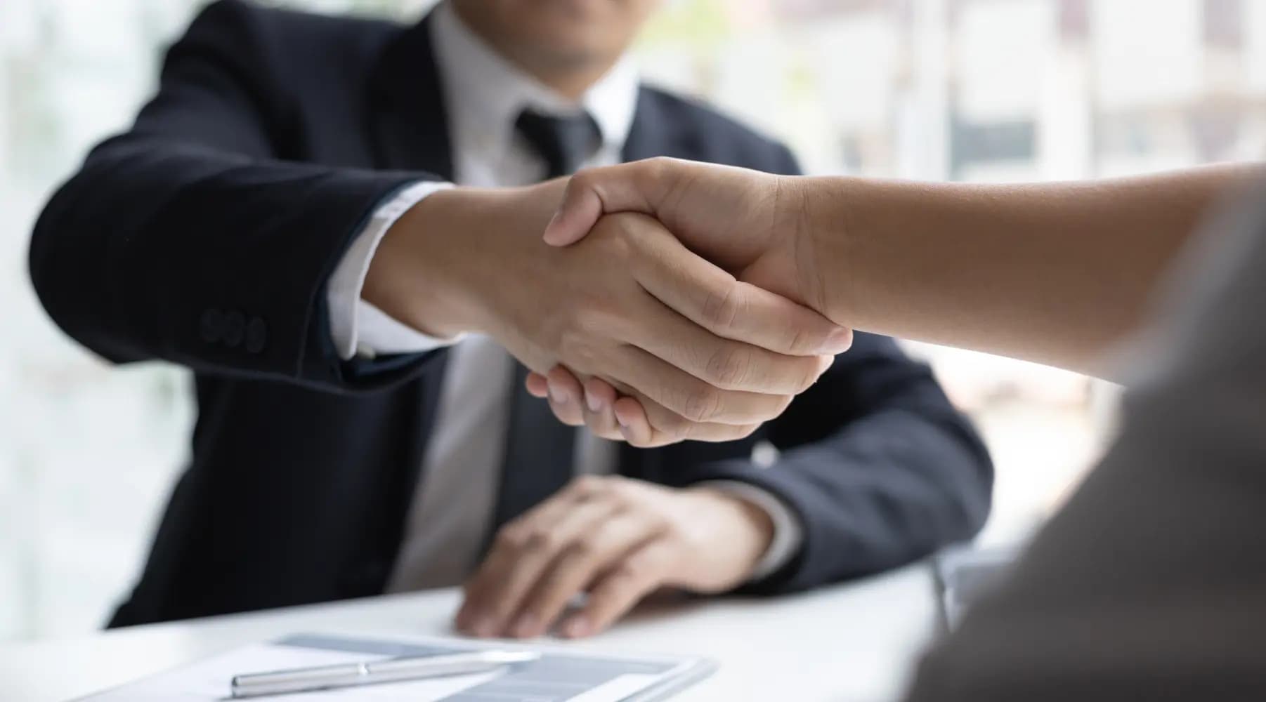 Businessmen handshaking at an job interview
