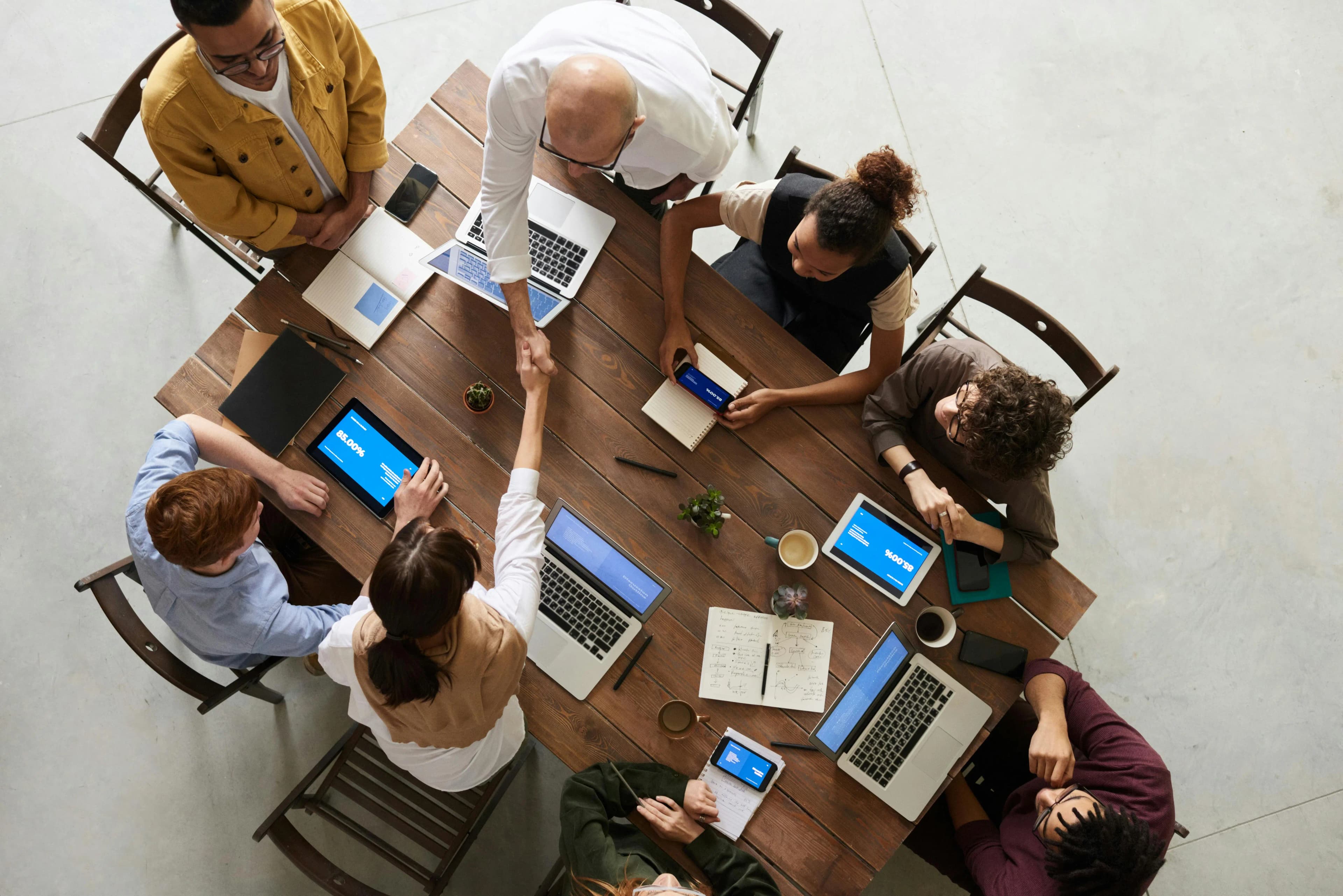 Business worker discussing around a table in an aerial view